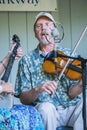 Male Singing and Playing a Violin